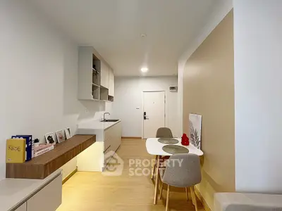 Modern minimalist kitchen with dining area and sleek cabinetry