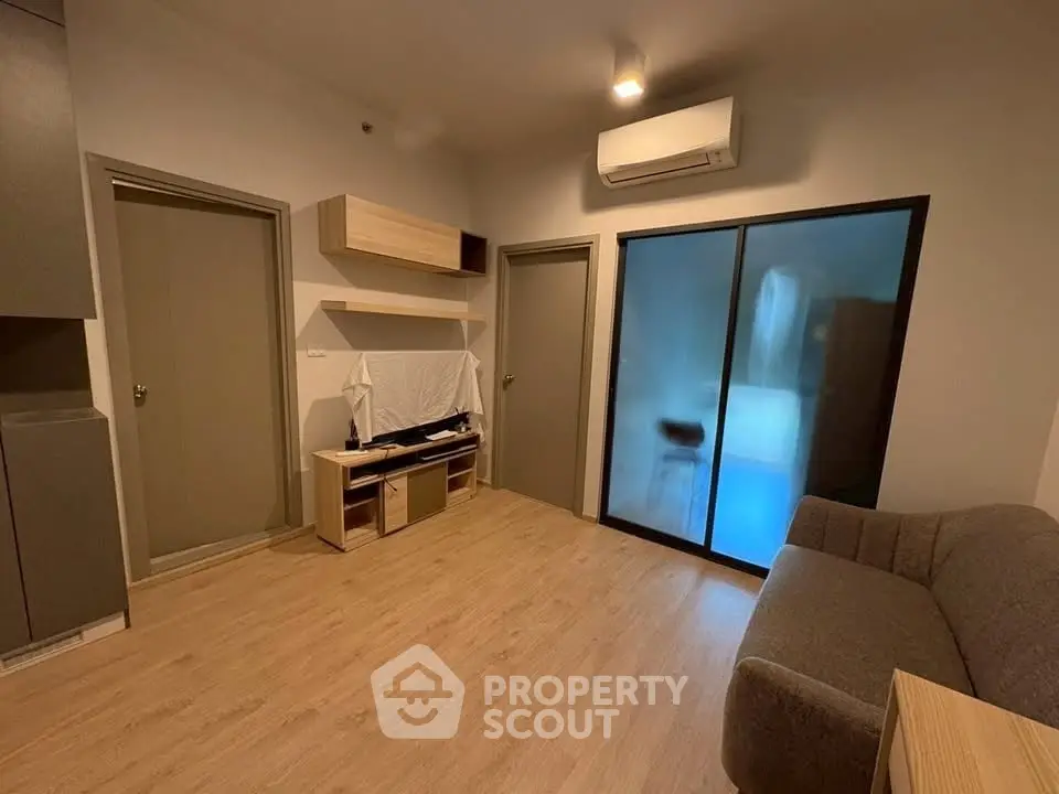 Modern living room with wooden flooring and air conditioning