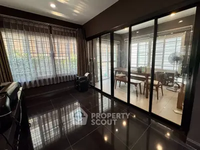 Spacious modern living area with glass sliding doors and natural light