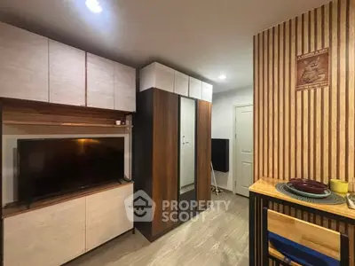 Modern living room with stylish wooden accents and sleek storage solutions.
