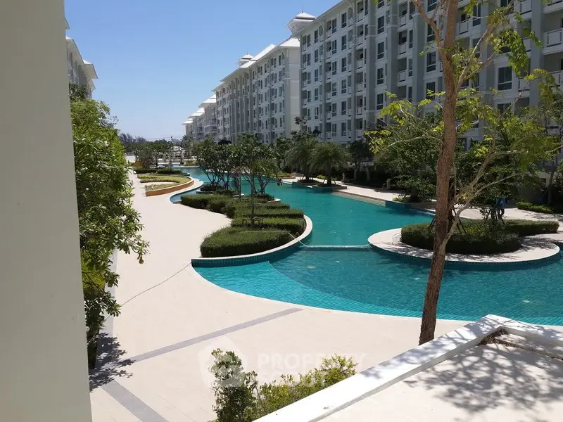 Luxurious apartment complex with stunning pool and landscaped gardens