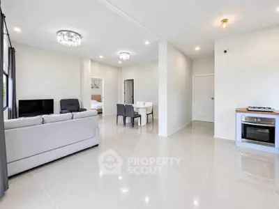 Spacious modern living room with open layout and elegant lighting
