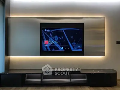 Modern living room with sleek entertainment center and ambient lighting