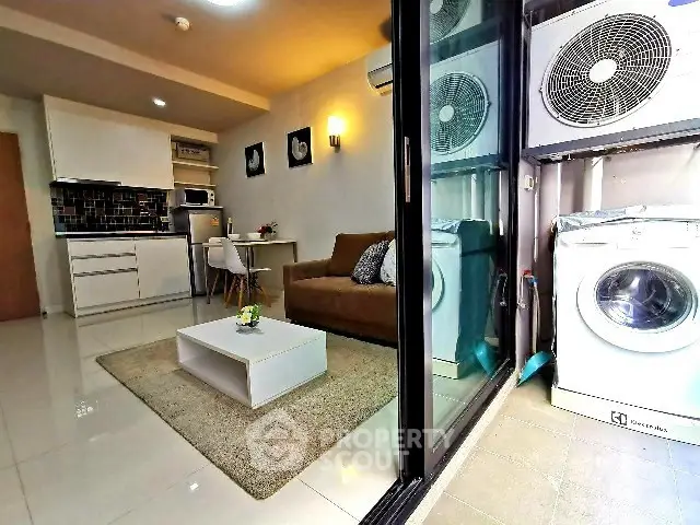 Modern apartment with cozy living room and laundry area