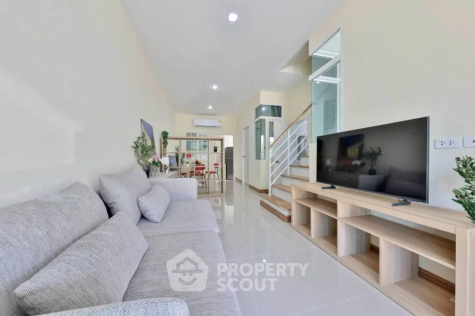 Spacious modern living room with sleek design and natural light