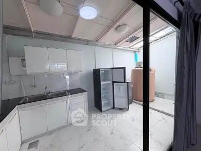 Modern kitchen with open layout and sleek appliances in a bright, airy space.