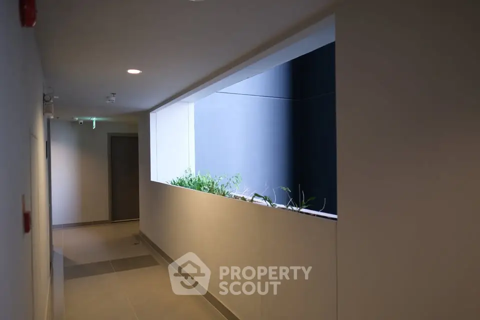 Modern apartment corridor with natural light and sleek design