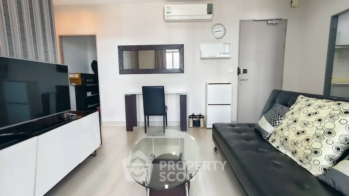 Modern living room with sleek furniture and stylish decor in a contemporary apartment.
