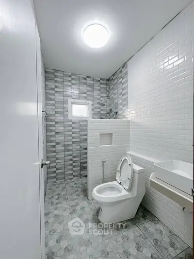 Modern bathroom with stylish tile design and sleek fixtures