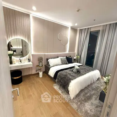Luxurious modern bedroom with elegant decor and plush furnishings, featuring a stylish vanity and ambient lighting.