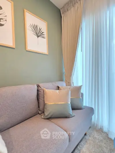 Stylish living room with modern sofa and elegant curtains, perfect for cozy relaxation.