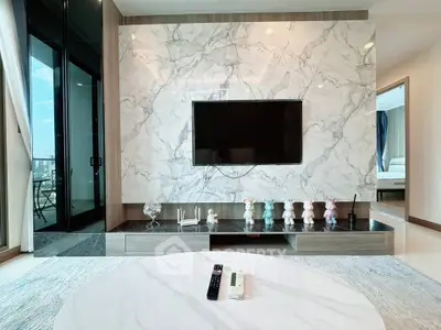 Luxurious living room with marble accent wall and modern decor