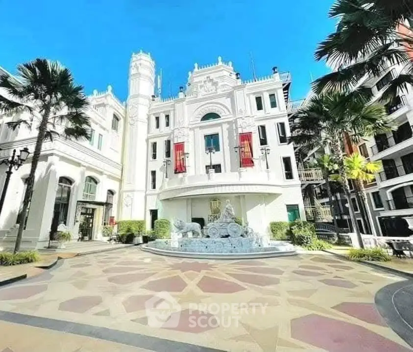 Stunning architectural building with elegant facade and courtyard fountain, perfect for luxury living.