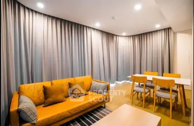 Modern living room with stylish furniture and warm lighting, perfect for relaxation and entertaining.