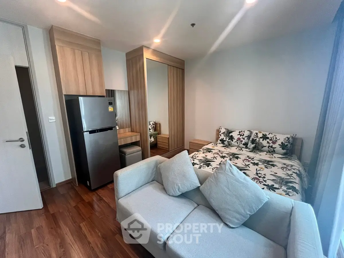 Modern studio apartment with cozy living area and stylish decor