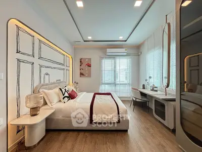 Luxurious modern bedroom with stylish decor and ample natural light.