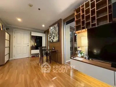 Spacious living room with modern decor and wooden flooring