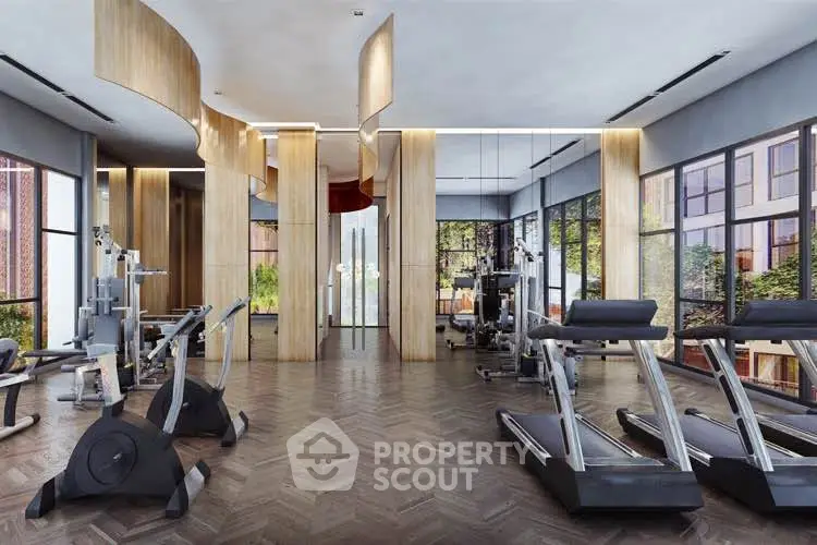Luxurious modern gym with state-of-the-art equipment and floor-to-ceiling windows in a high-end residential building.