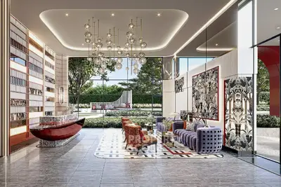 Luxurious modern lobby with elegant seating and stunning chandelier in upscale building.
