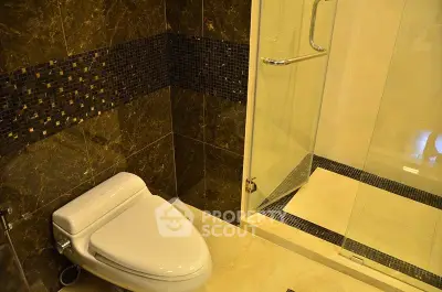 Luxurious bathroom with elegant marble tiles and modern shower design