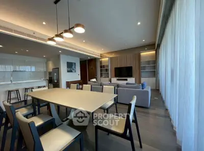 Spacious modern living room with open kitchen and elegant dining area