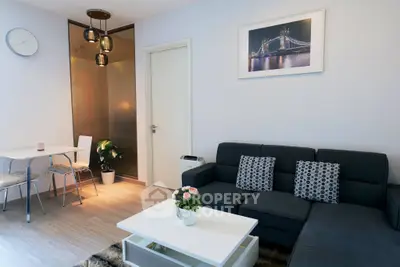 Modern living room with stylish decor and cozy seating area, perfect for relaxation and entertaining.