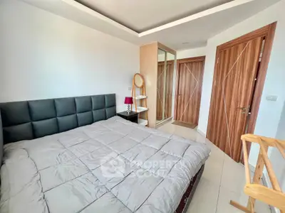 Modern bedroom with stylish decor and ample natural light