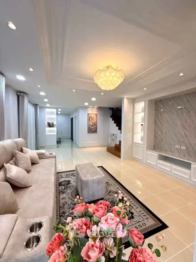 Luxurious living room with elegant decor, plush seating, and ambient lighting, perfect for relaxation and entertainment.