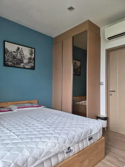Modern bedroom with stylish decor and built-in wardrobe