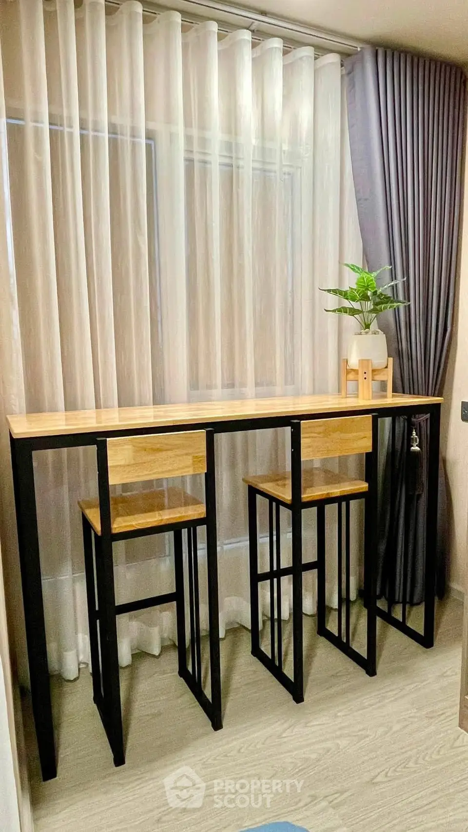 Modern interior with stylish high table and chairs, perfect for compact living spaces.
