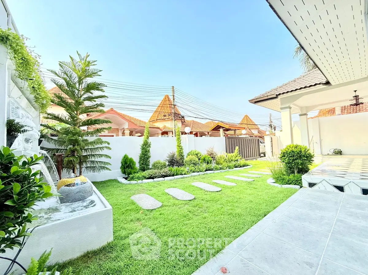 Charming garden with lush greenery and stepping stones in a serene residential backyard.