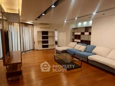 Spacious modern living room with hardwood floors and stylish furniture