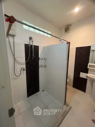 Modern bathroom with open shower and sleek tile design