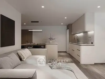 Modern open-layout living room with sleek kitchen and cozy seating area, perfect for contemporary living.