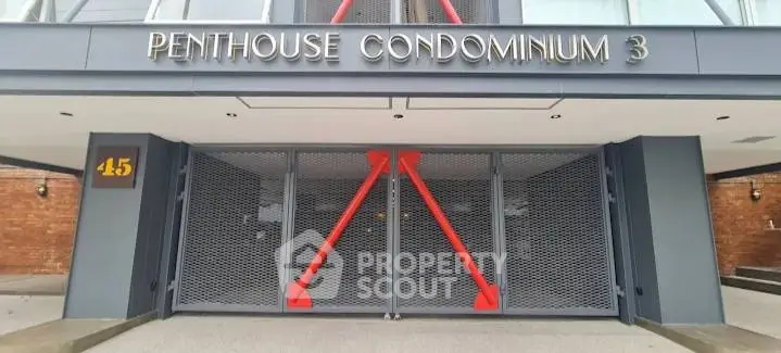 Modern entrance of Penthouse Condominium 3 with sleek design and secure gates.