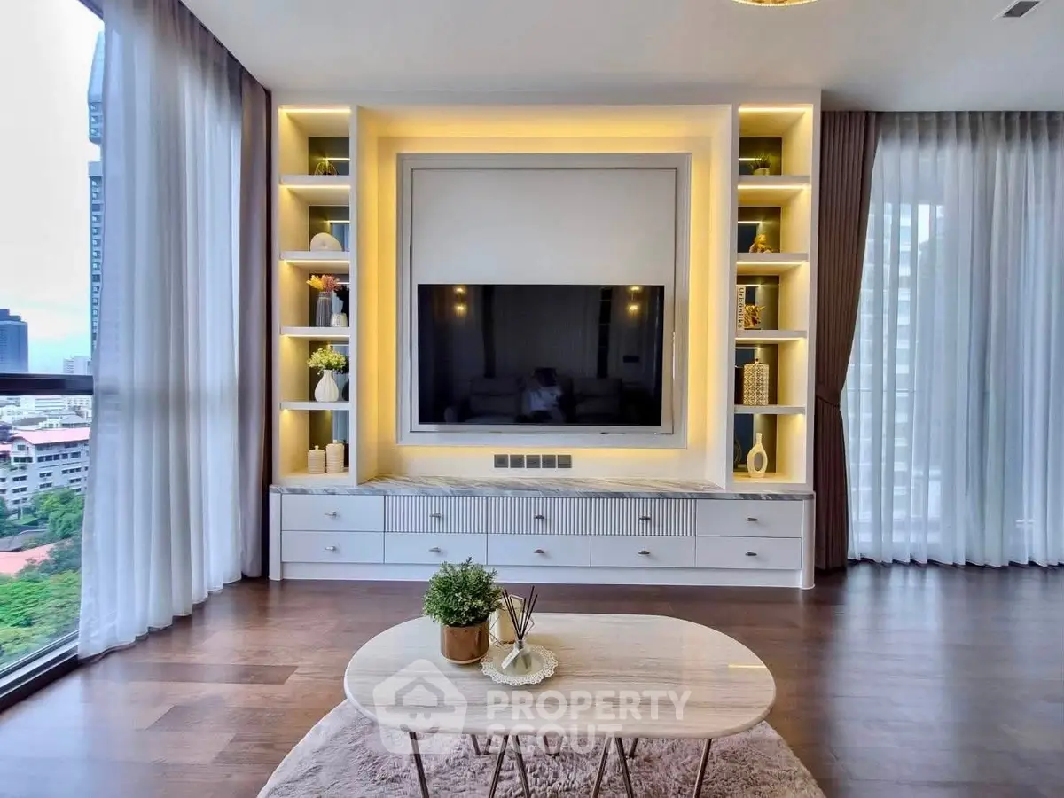 Luxurious living room with modern built-in entertainment center and panoramic city view.