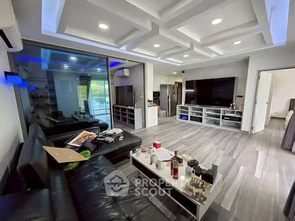 Modern living room with sleek design and large TV setup