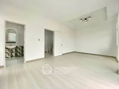Spacious modern living room with sleek flooring and stylish lighting