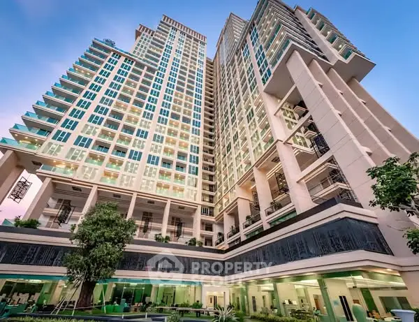 Stunning modern high-rise building with lush greenery and elegant architectural design.