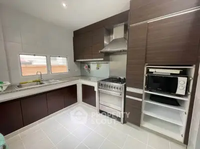 Modern kitchen with sleek cabinetry and stainless steel appliances