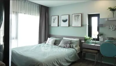 Modern bedroom with stylish decor and natural light, featuring a cozy bed and elegant furnishings.