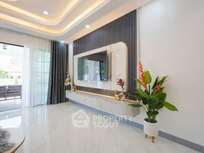 Luxurious modern living room with elegant decor and large TV setup