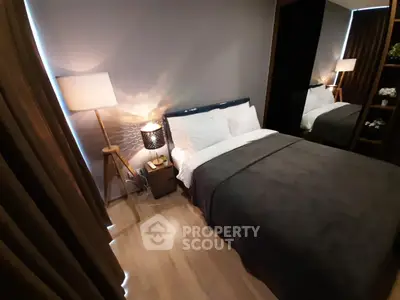 Cozy modern bedroom with stylish decor and ambient lighting