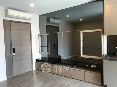 Modern living room with sleek built-in storage and air conditioning