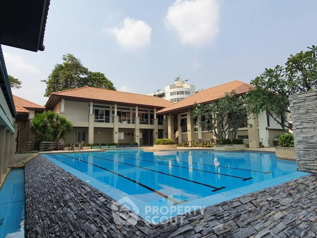 Luxurious residential complex with pristine swimming pool and modern architecture