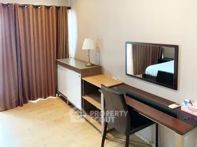 Spacious bedroom with elegant furniture and natural light