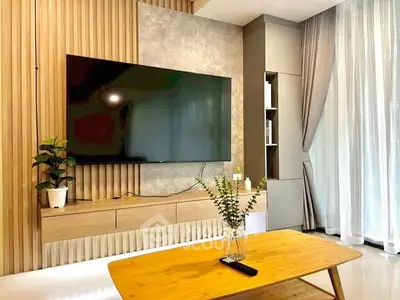 Modern living room with sleek TV setup and stylish decor