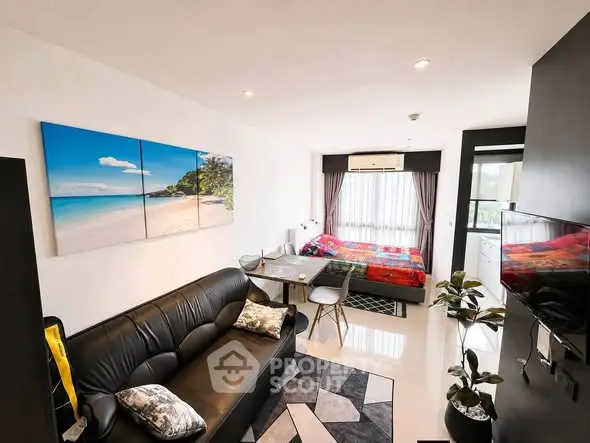 Modern studio apartment with stylish decor and open layout, featuring a cozy living area and vibrant bedroom.