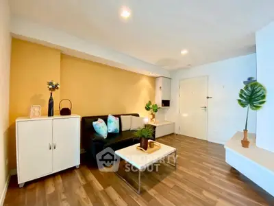 Modern living room with stylish decor and wooden flooring