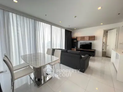 Spacious modern living room with elegant dining area and large windows